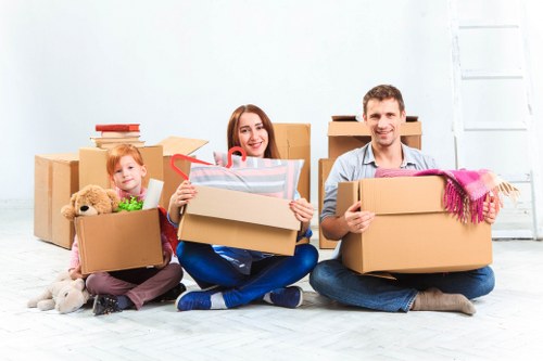 Professional movers handling items in a Crystal Palace flat