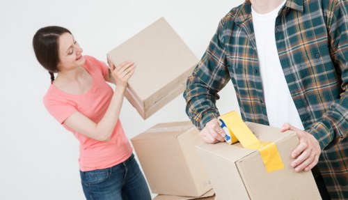 Local team loading sofas and household furniture for pick-up