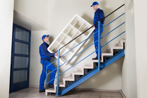 Professional movers handling furniture during a local move