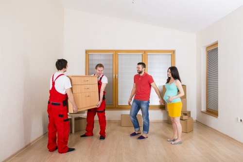 Removal crew loading household belongings safely