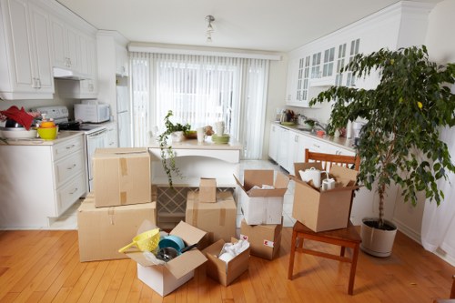 Movers preparing furniture and boxes for transport