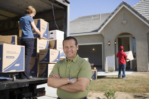 Household items being loaded into a moving van near Crystal Palace