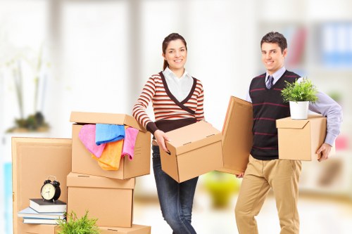 Packed moving boxes and furniture ready for transport in Crystalpalace