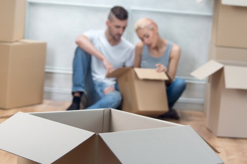 House removalists moving furniture through a residential property