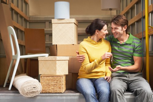 Trained movers handling furniture with care during a relocation